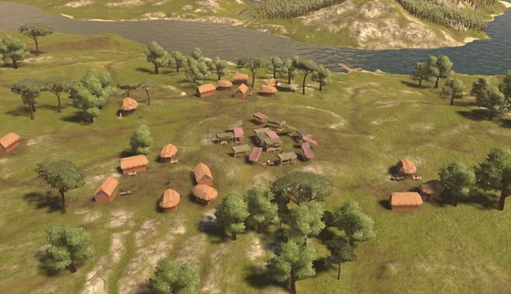 A village of timber huts on green hills by a river, seen from above.